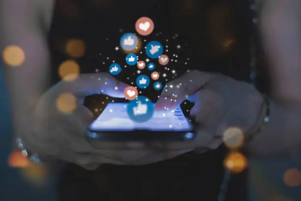 Business owner reviewing social media engagement on a phone