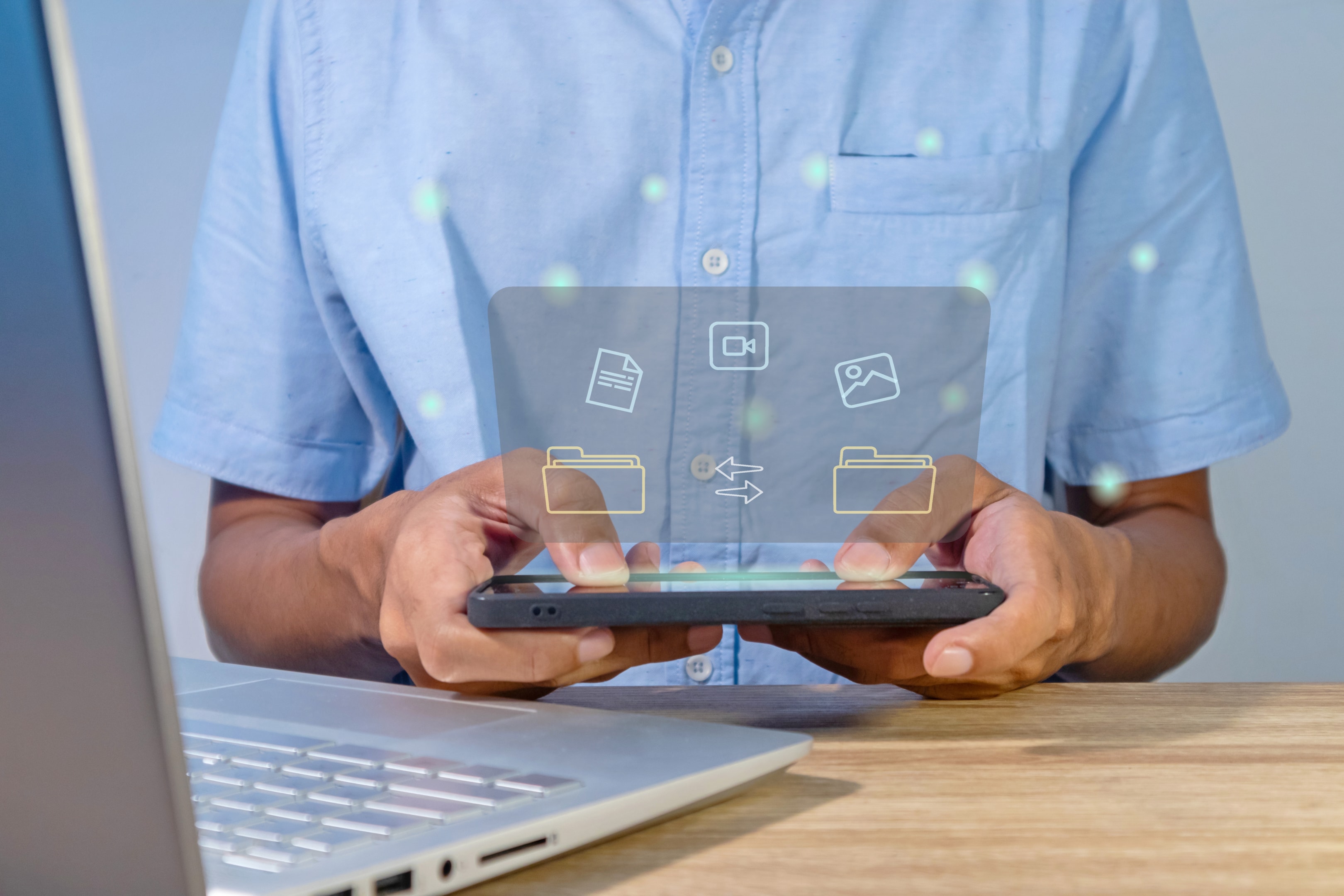 Team guiding customer onboarding with a laptop